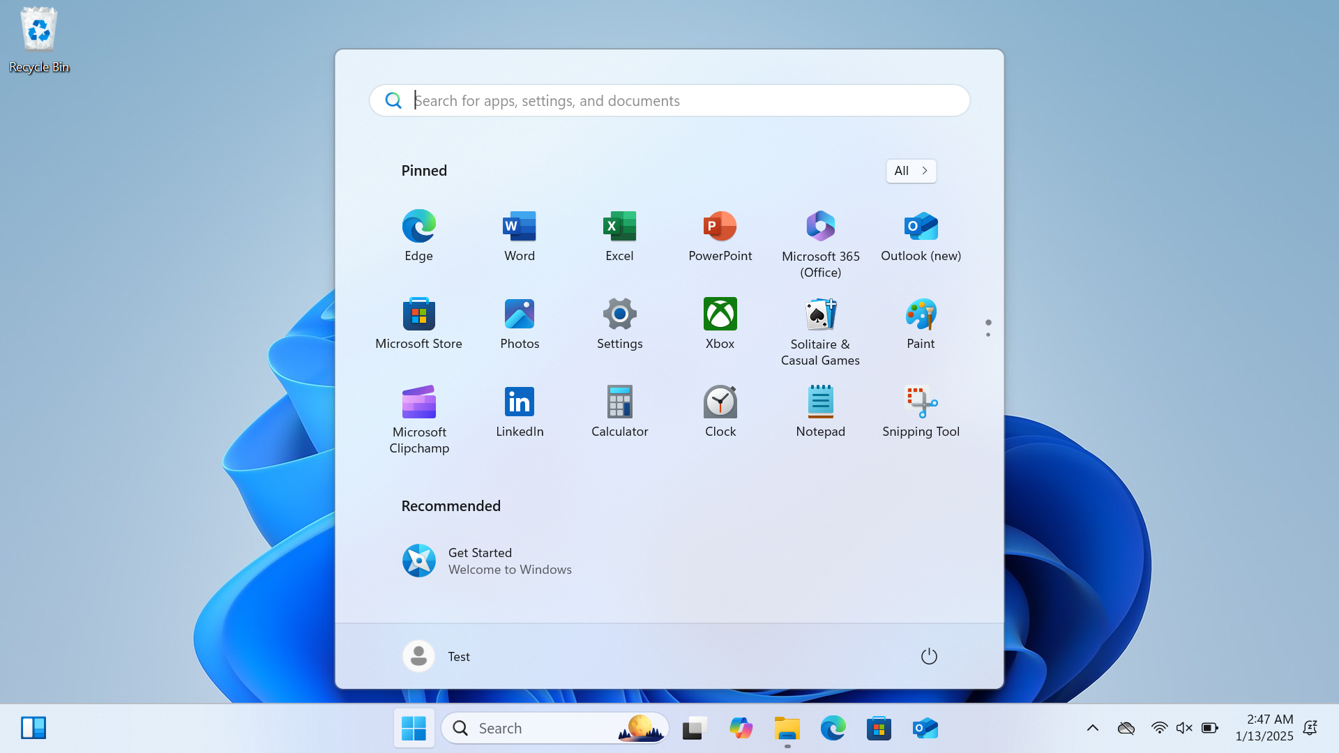 The image shows a Windows 11 Start Menu. At the top is a search bar, followed by pinned application icons such as Edge, Store, and File Explorer. Below the pinned section is a recommended items list suggesting "Get Started" and "Welcome to Windows." The user profile name "Test" and a power button are visible at the bottom. The taskbar shows icons for Start, Search, Task View, Widgets, File Explorer, Microsoft Edge, and Microsoft Store. The clock reads 2:47 AM on 1/13/2025. The desktop background consists of a blue abstract design with a "Recycle Bin" icon in the top left.